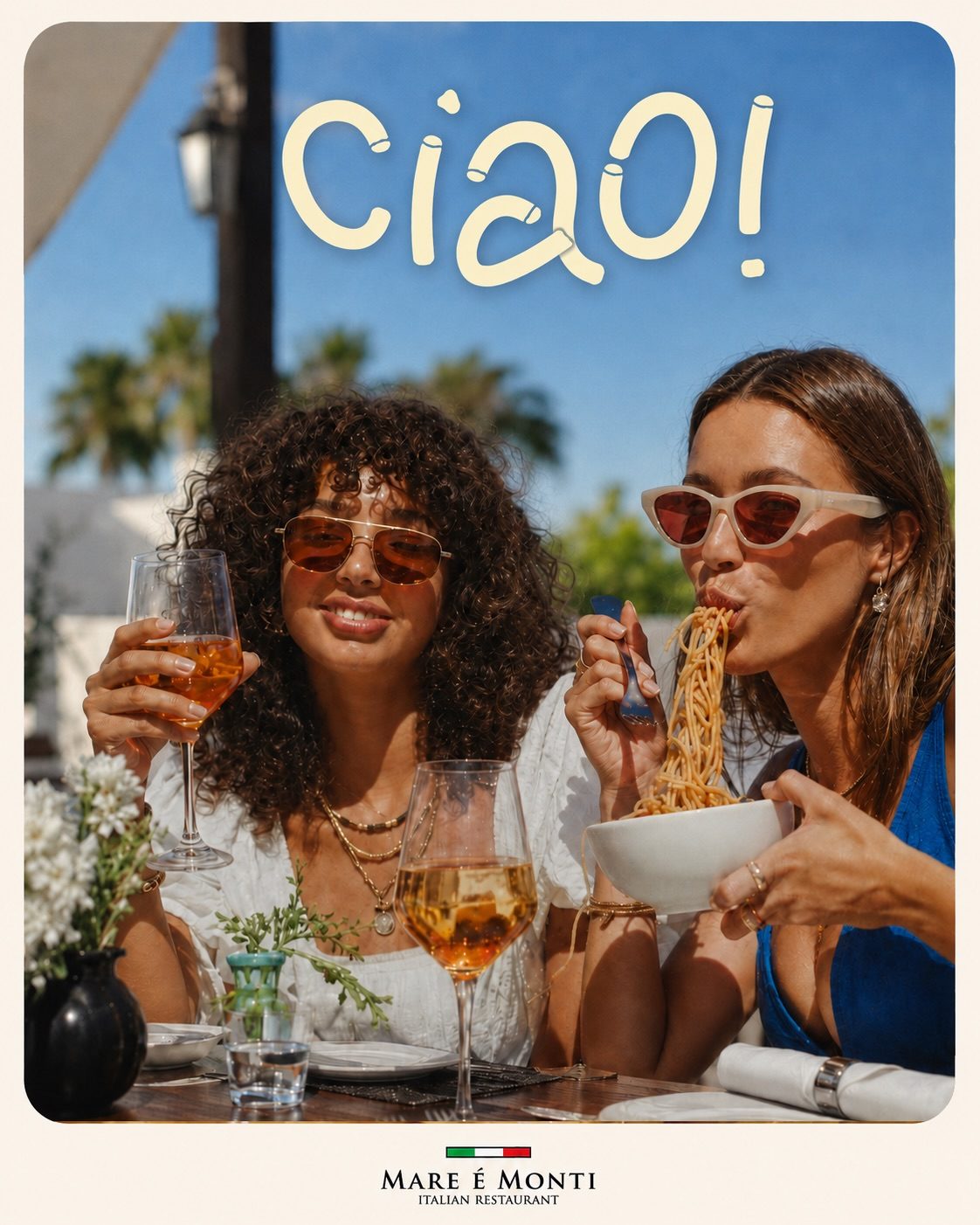 Guests sharing pasta and spritz outside in the sun