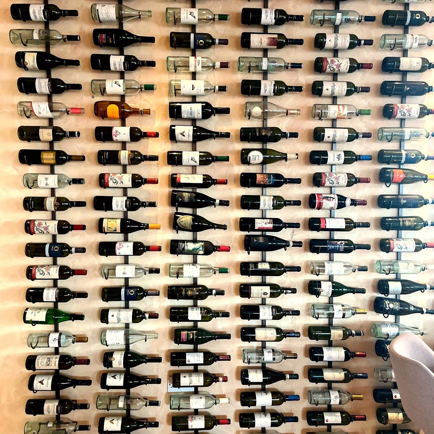 The wine wall at Mare é Monti, bottles racked from floor to ceiling
